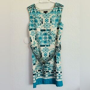 The limited teal and ivory geometric pattern dress